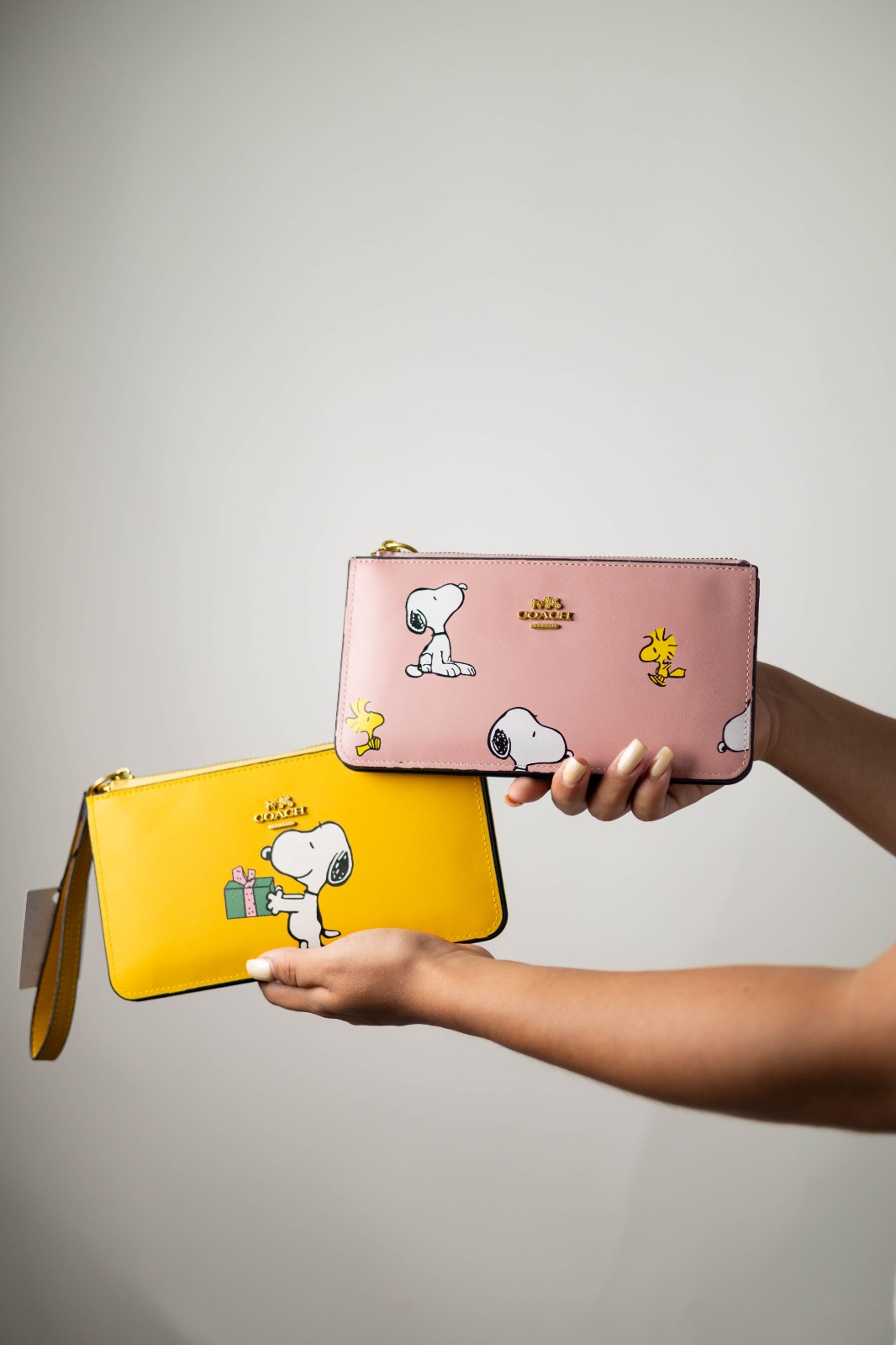 d40b1539-5ce3-4d15-a340-15f10af2ce1f CARTERA AMARILLA COACH SNOPI