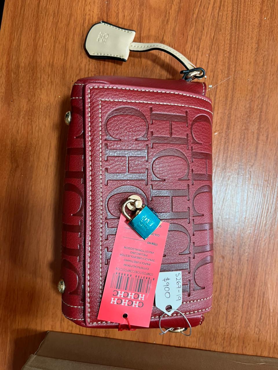 WhatsApp Image 2025-11-10 at 1.29.19 PM (1) Bolsa Carolina Herrera color Roja con letras en rojo obscuro