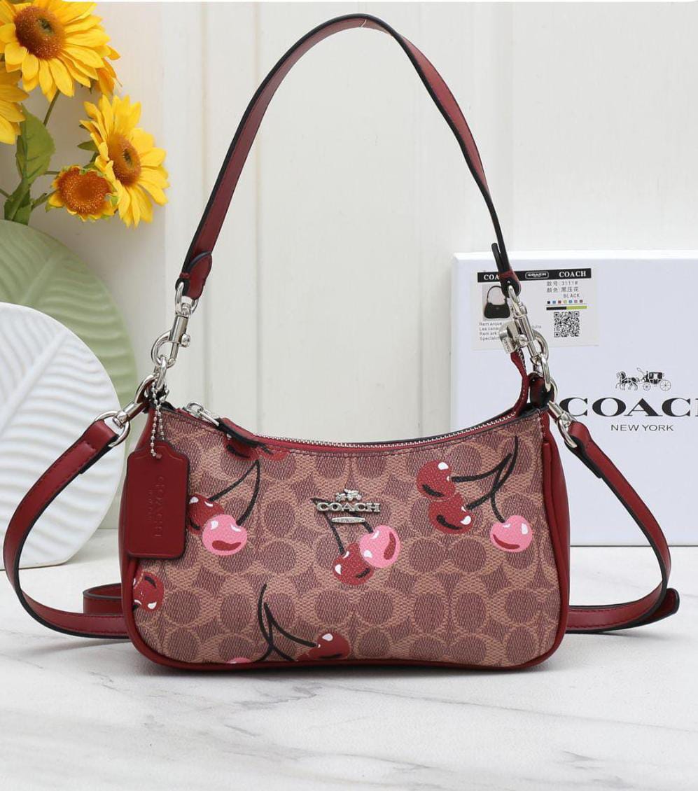 WhatsApp Image 2025-12-18 at 4.27.25 PM Bolsa Coach Teri Monograma Cafe con Cerezas