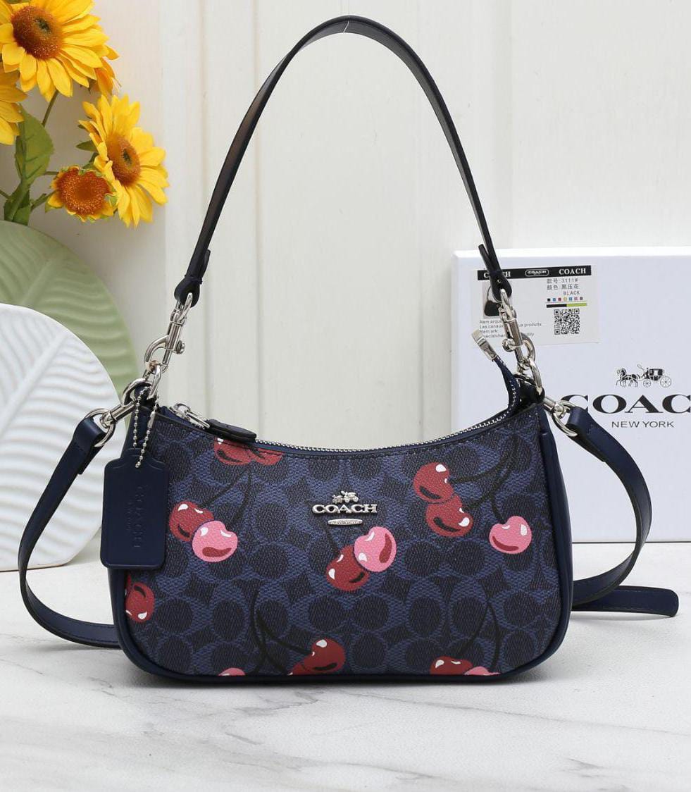 WhatsApp Image 2025-12-18 at 4.27.53 PM Bolsa Coach Teri Monograma Azul con Cerezas
