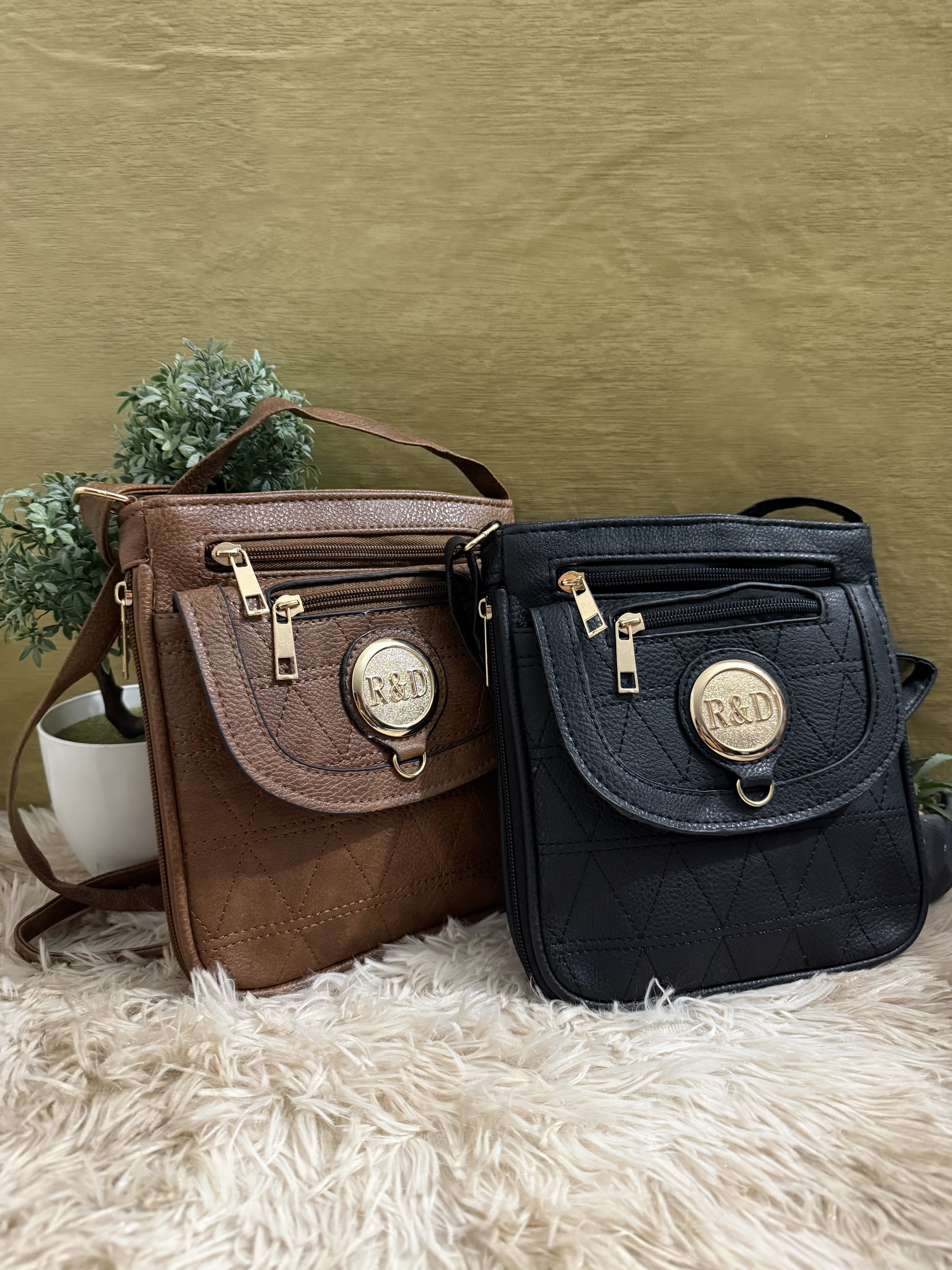 Mariconeras negra y cafe